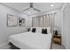 Cozy bedroom with neutral decor, art, and soft lighting creating a relaxing atmosphere at 4003 W Bay Ave, Tampa, FL 33616