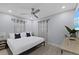 Modern bedroom features a TV, ceiling fan and bright walls at 4003 W Bay Ave, Tampa, FL 33616