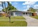Charming single-story home featuring a well-manicured lawn and inviting front porch at 4003 W Bay Ave, Tampa, FL 33616