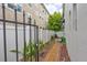 Backyard space with greenery, brick pathway, and privacy fence at 406 S Melville Ave # 1, Tampa, FL 33606
