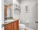 Bathroom with granite countertop and shower with brown tile at 406 S Melville Ave # 1, Tampa, FL 33606
