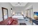 Bright bedroom with sitting area, ceiling fan, and ample light at 406 S Melville Ave # 1, Tampa, FL 33606