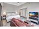 Spacious bedroom featuring sitting area, ceiling fan, and ample light at 406 S Melville Ave # 1, Tampa, FL 33606