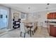 Dining room featuring a large table, stylish chairs, and an open layout into the kitchen at 406 S Melville Ave # 1, Tampa, FL 33606