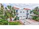 Stunning two-story townhouse featuring a red tile roof, a balcony, and a well-manicured front yard at 406 S Melville Ave # 1, Tampa, FL 33606