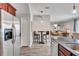 Open concept kitchen features stainless steel refrigerator and view of living room at 406 S Melville Ave # 1, Tampa, FL 33606