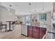 Open concept kitchen features stainless appliances, island and sightlines to living room at 406 S Melville Ave # 1, Tampa, FL 33606