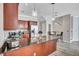 Well-lit kitchen features island, stainless appliances, and wood cabinets at 406 S Melville Ave # 1, Tampa, FL 33606