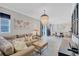 Cozy living room featuring a comfy sofa, a chandelier, and an open layout at 406 S Melville Ave # 1, Tampa, FL 33606