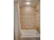 Shower featuring beige tile and shower curtain at 406 S Melville Ave # 1, Tampa, FL 33606