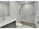 Modern bathroom features a glass-enclosed shower with marble tile surround at 455 Pinellas Bayway S # 2A, Tierra Verde, FL 33715