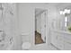 Bright bathroom featuring modern fixtures, a toilet, and a tiled shower at 455 Pinellas Bayway S # 2A, Tierra Verde, FL 33715