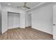 Bedroom with hardwood floors, closet, and a view to the hallway and closet at 455 Pinellas Bayway S # 2A, Tierra Verde, FL 33715