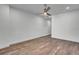 Bedroom with beautiful wood flooring, ceiling fan, and a bright window at 455 Pinellas Bayway S # 2A, Tierra Verde, FL 33715