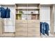 Custom closet with shelving, drawers, and hanging rods for organization at 455 Pinellas Bayway S # 2A, Tierra Verde, FL 33715