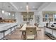 Bright dining area with modern chandelier, adjacent to kitchen and living area at 455 Pinellas Bayway S # 2A, Tierra Verde, FL 33715