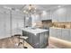 Spacious kitchen featuring a large island with seating and modern appliances at 455 Pinellas Bayway S # 2A, Tierra Verde, FL 33715