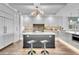 Modern kitchen with stainless steel appliances, a large island, and counter seating at 455 Pinellas Bayway S # 2A, Tierra Verde, FL 33715