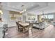 Open-concept living area with ample seating, natural light, and balcony access at 455 Pinellas Bayway S # 2A, Tierra Verde, FL 33715