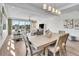 Bright living area with balcony access, modern lighting, and comfortable seating at 455 Pinellas Bayway S # 2A, Tierra Verde, FL 33715