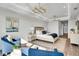 Light-filled main bedroom with sitting area, chandelier, and contemporary decor at 455 Pinellas Bayway S # 2A, Tierra Verde, FL 33715