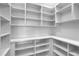 Spacious walk-in pantry with custom shelving, providing ample storage space at 455 Pinellas Bayway S # 2A, Tierra Verde, FL 33715