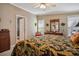 This bedroom has a bed with a tropical print comforter and matching throw pillows with furniture at 4851 W Gandy Blvd # B09L23, Tampa, FL 33611