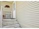 The home's front entrance has concrete steps and a small porch sitting area with vinyl siding on the exterior at 4851 W Gandy Blvd # B09L23, Tampa, FL 33611