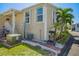 The home's exterior has palm trees, vinyl siding, with an electric generator outside and a grill at 4851 W Gandy Blvd # B09L23, Tampa, FL 33611