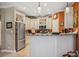 Modern kitchen with white cabinets, stainless steel appliances, granite counters, and ample storage at 4851 W Gandy Blvd # B09L23, Tampa, FL 33611