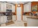 Well-equipped kitchen featuring stainless steel appliances, tile flooring, and ample counter space at 4851 W Gandy Blvd # B09L23, Tampa, FL 33611