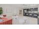 Open-concept living room with modern decor and a view of the kitchen, perfect for entertaining at 504 N Habana Ave, Tampa, FL 33609