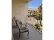 Relaxing balcony with two chairs and a view of the complex at 5557 Sea Forest Dr # 216, New Port Richey, FL 34652