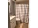 Cozy bathroom features a toilet, shower, and decorative shower curtain at 5557 Sea Forest Dr # 216, New Port Richey, FL 34652
