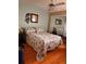 Comfortable bedroom features a queen bed, mirrors, and a modern ceiling fan at 5557 Sea Forest Dr # 216, New Port Richey, FL 34652