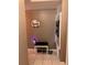 Entryway with a decorative 'Home' sign, bench, and wall decor accents at 5557 Sea Forest Dr # 216, New Port Richey, FL 34652