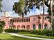 Charming pink building with lush green landscaping at 5557 Sea Forest Dr # 216, New Port Richey, FL 34652