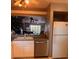 Kitchen features a pass-through to living area and stainless steel appliances at 5557 Sea Forest Dr # 216, New Port Richey, FL 34652