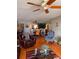 Cozy living room features hardwood floors, ceiling fan and comfortable seating arrangements at 5557 Sea Forest Dr # 216, New Port Richey, FL 34652