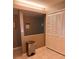 Spacious pantry with white bi-fold doors and adjacent shelving at 5557 Sea Forest Dr # 216, New Port Richey, FL 34652