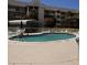 Community pool with plenty of seating at 5557 Sea Forest Dr # 216, New Port Richey, FL 34652