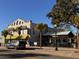 Charming restaurant with outdoor seating and palm trees at 5557 Sea Forest Dr # 216, New Port Richey, FL 34652