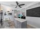 Cozy kitchen featuring an island, stainless appliances, and a breakfast nook with natural light and seating at 5805 S Hubert Ave, Tampa, FL 33616
