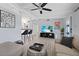 Bright and airy living room with modern furnishings, ceiling fan, and seamless flow to dining area at 5805 S Hubert Ave, Tampa, FL 33616