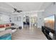 Open-concept living area with a comfortable sofa, bar seating, and a seamless connection to the modern kitchen at 5805 S Hubert Ave, Tampa, FL 33616