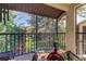 Screened balcony featuring views of lush greenery at 612 Fairmont Ave # D, Safety Harbor, FL 34695