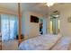 Bedroom with a TV and a view into the en suite bathroom and sitting area at 612 Fairmont Ave # D, Safety Harbor, FL 34695