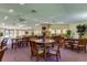 Comfortable clubhouse with a fireplace, tables and chairs for community gatherings at 612 Fairmont Ave # D, Safety Harbor, FL 34695