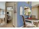 Open dining area view leading to the kitchen and other rooms with natural light at 612 Fairmont Ave # D, Safety Harbor, FL 34695