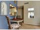 Cozy dining area with pass-through to kitchen, table and chair set with decorated seating at 612 Fairmont Ave # D, Safety Harbor, FL 34695